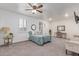Spacious bedroom with large bed, ceiling fan, and ample natural light at 11844 W Nadine Way, Peoria, AZ 85383