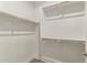 Bright walk-in closet with shelves and metal rod at 11844 W Nadine Way, Peoria, AZ 85383