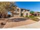 Attractive two-story home with a brick driveway, well-kept lawn, and a two car garage at 11844 W Nadine Way, Peoria, AZ 85383