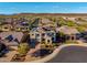 Attractive two-story home featuring a well-manicured front yard, solar panels, and views of the surrounding desert landscape at 11844 W Nadine Way, Peoria, AZ 85383