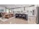 Kitchen with dining area featuring white cabinetry, stainless steel appliances, and modern finishes at 11844 W Nadine Way, Peoria, AZ 85383
