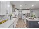 Well-lit kitchen featuring quartz countertops, stainless steel appliances, and white cabinets at 11844 W Nadine Way, Peoria, AZ 85383