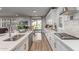 Bright kitchen with stainless steel appliances, white cabinets, and a view of the backyard at 11844 W Nadine Way, Peoria, AZ 85383
