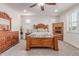 Main bedroom featuring carpet flooring and natural wood furniture at 11844 W Nadine Way, Peoria, AZ 85383