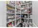 Walk-in pantry with ample shelving for organized storage at 11844 W Nadine Way, Peoria, AZ 85383