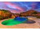 Backyard oasis featuring a lagoon-style pool with rock waterfall and hot tub for luxurious outdoor living at 11844 W Nadine Way, Peoria, AZ 85383
