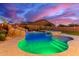 Stunning backyard pool with rock waterfall and hot tub offering a private retreat for relaxation and entertainment at 11844 W Nadine Way, Peoria, AZ 85383