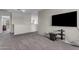 Upstairs loft area with plush carpet, TV, and view to the floor below at 1237 W Agrarian Hills Dr, San Tan Valley, AZ 85143