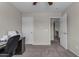 Home office space with desk, chair, carpet, and multiple doors for access at 1237 W Agrarian Hills Dr, San Tan Valley, AZ 85143