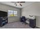 Bedroom used as office with window, carpet, ceiling fan, and view of the neighborhood at 1237 W Agrarian Hills Dr, San Tan Valley, AZ 85143