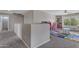 Large playroom filled with toys, a colorful alphabet rug, and storage shelves, perfect for children at 1237 W Agrarian Hills Dr, San Tan Valley, AZ 85143