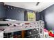Playful bedroom with a loft bed, string lights, and cheerful decor at 125 S 56Th St # 36, Mesa, AZ 85206
