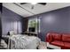 Bedroom with canopy bed frame, a ceiling fan, and a window overlooking the backyard at 125 S 56Th St # 36, Mesa, AZ 85206