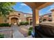 Exterior view from the front porch shows well maintained community landscaping and condo facades at 125 S 56Th St # 36, Mesa, AZ 85206