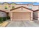 Attached single-car garage with tan door and complementary stucco exterior at 125 S 56Th St # 36, Mesa, AZ 85206
