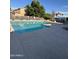 Large, inviting outdoor pool surrounded by a concrete deck and lounge chairs at 125 S 56Th St # 36, Mesa, AZ 85206