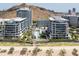 Stunning aerial view of modern condos with a pool and manicured landscaping at 140 E Rio Salado Pkwy # 512, Tempe, AZ 85281