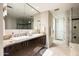 Bathroom vanity with double sinks, granite counters, and large mirror at 140 E Rio Salado Pkwy # 512, Tempe, AZ 85281
