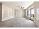 Spacious bedroom with ample natural light, ceiling fan, and a balcony with city views at 140 E Rio Salado Pkwy # 512, Tempe, AZ 85281