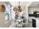 Dining area with a round table, elegant chandelier, and large windows, adjacent to a modern kitchen at 140 E Rio Salado Pkwy # 512, Tempe, AZ 85281