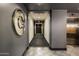 Contemporary condo hallway featuring updated flooring and mirror at 140 E Rio Salado Pkwy # 512, Tempe, AZ 85281