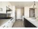 Modern kitchen with stainless steel appliances, white cabinets, stone countertops, and ample counter space at 140 E Rio Salado Pkwy # 512, Tempe, AZ 85281