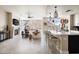 Open living room and kitchen with modern finishes, fireplace, and expansive windows boasting mountain views at 140 E Rio Salado Pkwy # 512, Tempe, AZ 85281