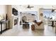 Open living area with fireplace, stylish decor, ceiling fan and expansive windows showcasing scenic mountain and city views at 140 E Rio Salado Pkwy # 512, Tempe, AZ 85281