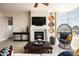 Bright living room with a fireplace, comfortable seating, and modern decor accents, with unique hanging chair at 140 E Rio Salado Pkwy # 512, Tempe, AZ 85281