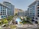 Beautiful exterior view of condos featuring a pool and well-maintained landscaping at 140 E Rio Salado Pkwy # 512, Tempe, AZ 85281