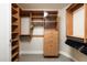 Spacious walk-in closet with wood shelving and ample storage space at 140 E Rio Salado Pkwy # 512, Tempe, AZ 85281
