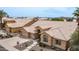 Aerial shot of a home showcasing its tile roof, well-manicured landscaping, and three-car garage at 14033 S 31St St, Phoenix, AZ 85048