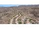 Aerial view of a desert neighborhood with well-maintained homes, tile roofs, and mountain backdrop at 14033 S 31St St, Phoenix, AZ 85048