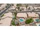 An aerial view shows the neighborhood homes and a mountain in the background on a sunny day at 14033 S 31St St, Phoenix, AZ 85048