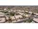 An aerial view shows the neighborhood homes and a mountain in the background on a sunny day at 14033 S 31St St, Phoenix, AZ 85048