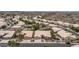 An aerial view shows the neighborhood homes and a mountain in the background on a sunny day at 14033 S 31St St, Phoenix, AZ 85048