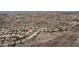 An aerial view shows the neighborhood homes and a mountain in the background on a sunny day at 14033 S 31St St, Phoenix, AZ 85048
