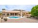 Backyard oasis features a freeform pool, desert landscaping, and an outdoor seating area with mountain views at 14033 S 31St St, Phoenix, AZ 85048