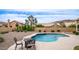 Private backyard featuring a refreshing pool, desert landscaping, and comfortable seating for outdoor relaxation at 14033 S 31St St, Phoenix, AZ 85048
