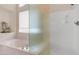 Bathroom with a glass shower, a tub, and a privacy window at 14033 S 31St St, Phoenix, AZ 85048