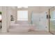 Bathroom features a tub, step-in shower, and a window at 14033 S 31St St, Phoenix, AZ 85048