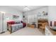 Cozy bedroom with a daybed, shelving, shutters, and a neutral color scheme at 14033 S 31St St, Phoenix, AZ 85048