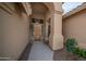 Close-up of an entryway with a decorative wood door and views of the surrounding architecture at 14033 S 31St St, Phoenix, AZ 85048