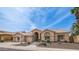 Charming single-story home featuring a tile roof, arched entryway, and well-maintained desert landscaping at 14033 S 31St St, Phoenix, AZ 85048