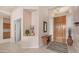 Home entryway with a wood door, console table, and neutral decor at 14033 S 31St St, Phoenix, AZ 85048