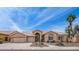 Charming single-story home with desert landscaping, inviting front walkway, and a well-manicured lawn at 14033 S 31St St, Phoenix, AZ 85048
