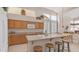 Kitchen with an island, seating, wood cabinets, and clerestory windows at 14033 S 31St St, Phoenix, AZ 85048