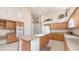Bright kitchen featuring wood cabinets, island, and modern appliances at 14033 S 31St St, Phoenix, AZ 85048
