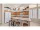 Kitchen with an island, seating, wood cabinets, and clerestory windows at 14033 S 31St St, Phoenix, AZ 85048