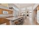 Bright kitchen features an island with seating, modern appliances, and ample natural light through large windows at 14033 S 31St St, Phoenix, AZ 85048